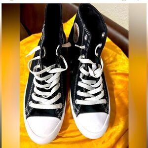 Black and White high top, platform, Converse tennis shoes.